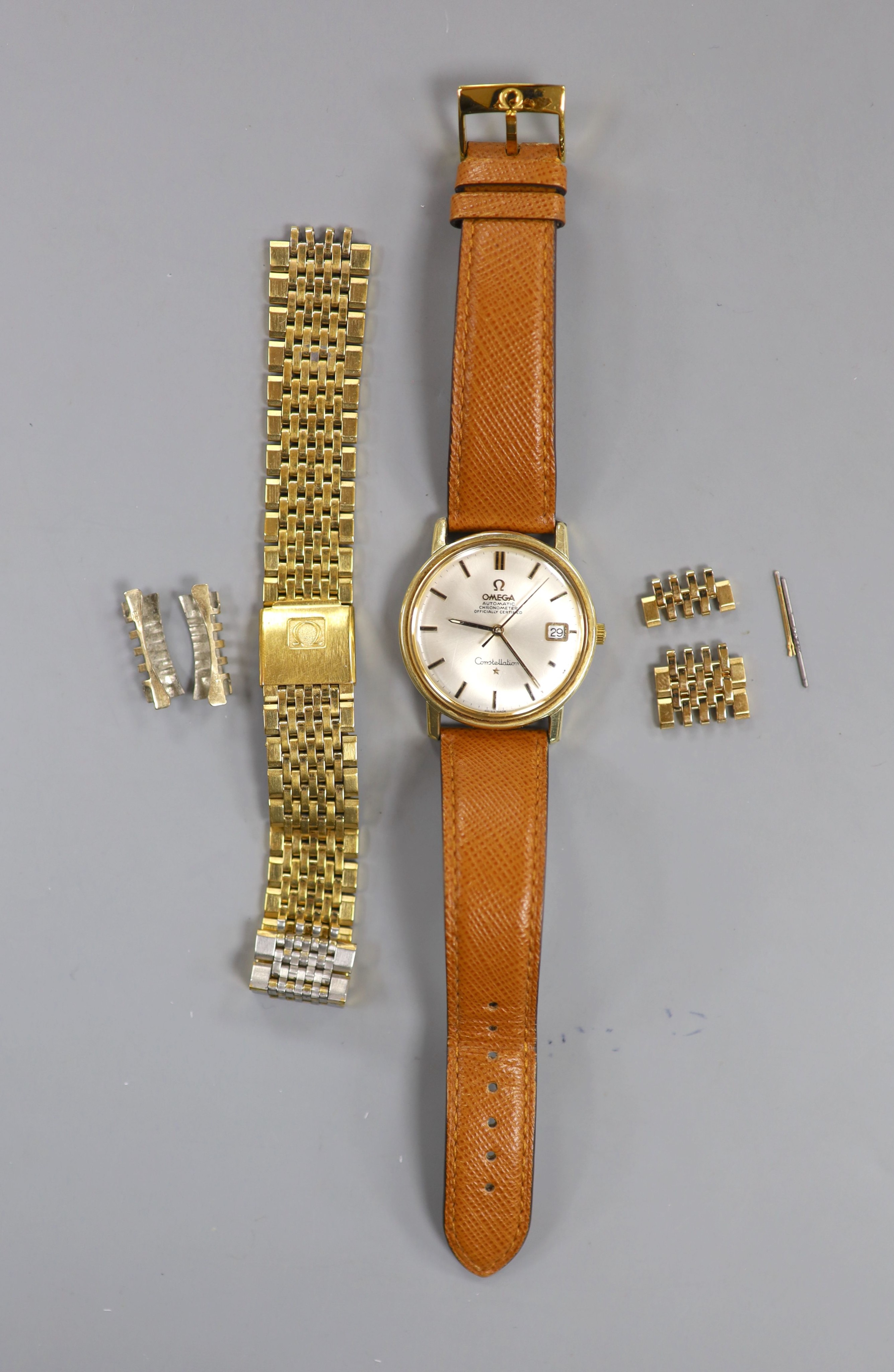 A gentleman's steel and gold plated Omega Constellation automatic wrist watch, on Omega leather strap, with spare Omega gold plated bracelet also, case diameter 35mm, with Omega box.